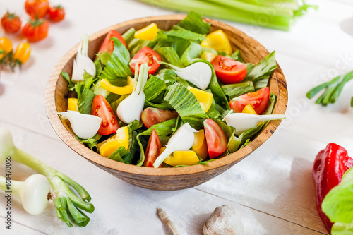 vegetable salad bowl on kitchen table, balanced diet
