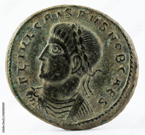 Ancient Roman copper coin of Emperor Crispus. Obverse. photo