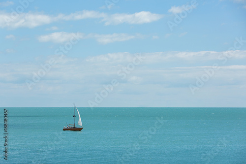 Yacht sails by sea, travel, blue sky and beautiful clouds