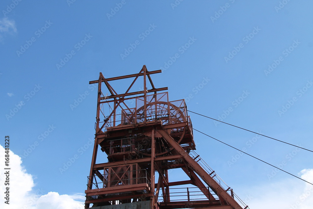 The Classic Winding Headstocks of a Coal Mine Pit. The Classic Winding Headstocks of a Coal Mine Pit.