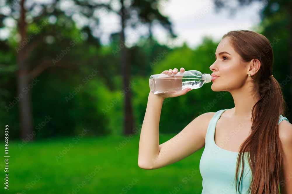 Woman drink from a water bottle, outdoor Woman drink from a water bottle, outdoor
