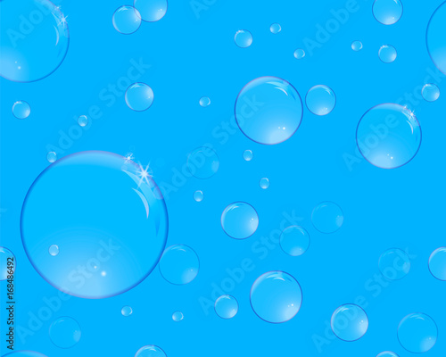 Soap bubbles with reflections on a blue background