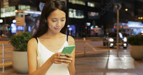 Wallpaper Mural Woman use of mobile phone at outdoor Torontodigital.ca