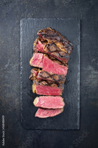 Barbecue Wagyu Entrecote sliced as close-up on a slate