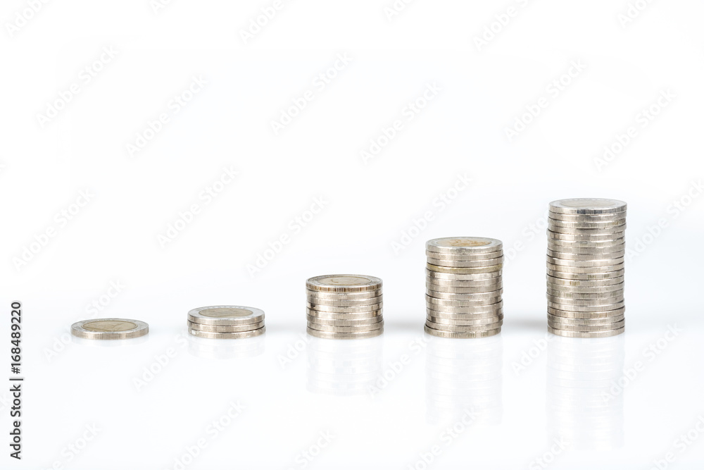 Savings, business growth, financial stability concept by several stacks of coins on white background. Savings, business growth, financial stability concept by several stacks of coins on white background.