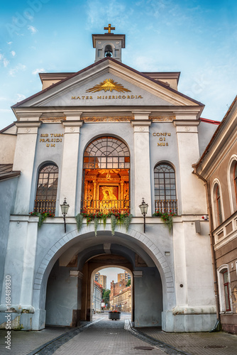 Vilnius, Lithuania: the Gate of Dawn, Lithuanian Ausros, Medininku vartai, Polish Ostra Brama, a city gate of Vilnius, one of its most important historical, cultural and religious monuments in sunrise