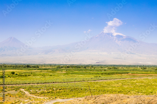 Landscape view of Mount Ararat in sunny day. Perspective on Mount Ararat and Rural landscape. Armenia 
