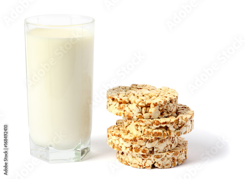 Glass of fresh milk with biscuit isolated on white background