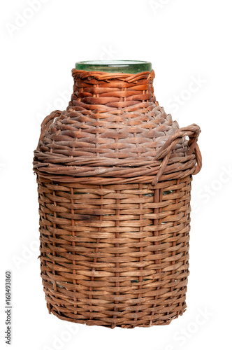 Old large jar in a wooden braid