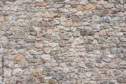 Gray stone wall construction pattern background.