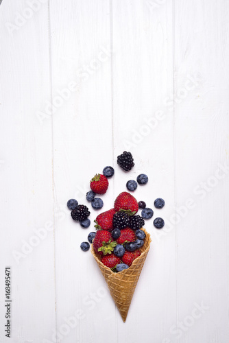 Summer berries in waffle cone photo