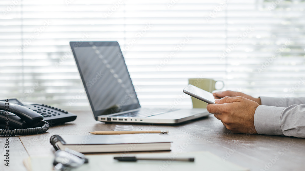 Fototapeta premium Businessman working at office desk