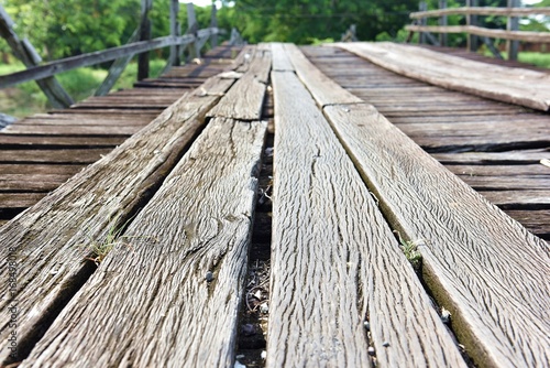 Old wooden bridge on the river.