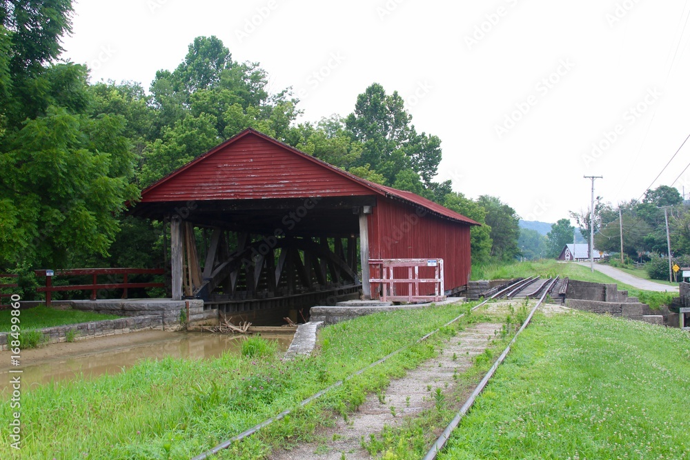 The old red covered bridge in the country. The old red covered bridge in the country.