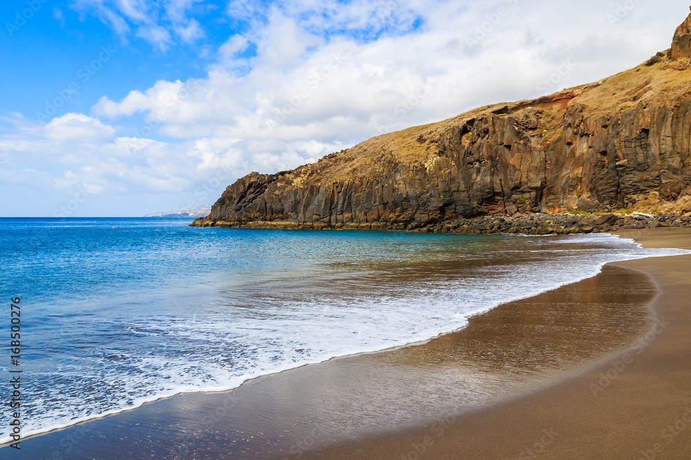 Ocean wave on beautiful Prainha beach with golden sand, Madeira island, Portugal