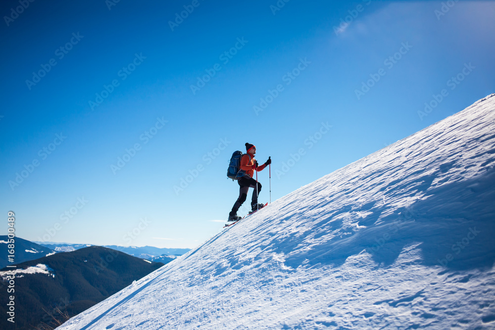 Climber in the winter mountains. Climber in the winter mountains.