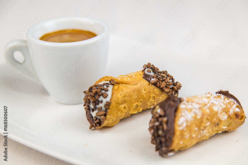 Sicilian Cannoli and coffee on white dish