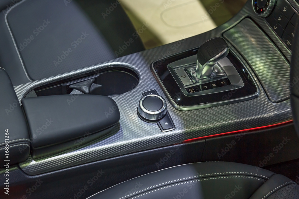 Detail of modern car interior focus on gear stick, Automatic transmission in luxury car