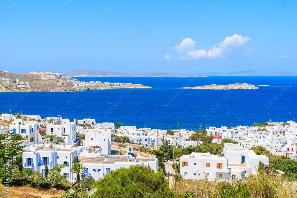 View of white houses of Mykonos town on coast of Mykonos island, Greece