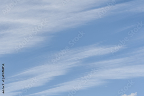 Blue skies with white cirrus clouds