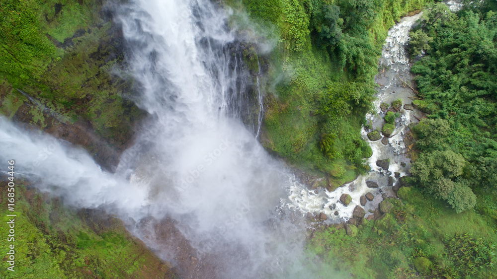 Beautiful waterfall.Tad Fan Waterfall in southern Laos.It is a place to visit the natural beauty.Mountain forest waterfall landscape.Top view,Aerial view,waterfall amazing nature background,Rainforest Beautiful waterfall.Tad Fan Waterfall in southern Laos.It is a place to visit the natural beauty.Mountain forest waterfall landscape.Top view,Aerial view,waterfall amazing nature background,Rainforest
