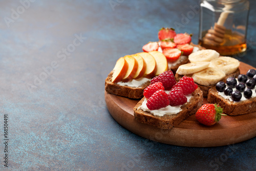 Toasts with cream cheese and fresh berries