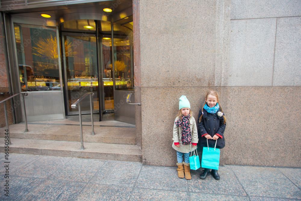 NEW YORK, USA - APRIL 18, 2014: Adorable little girls walking in New York City at spring sunny day