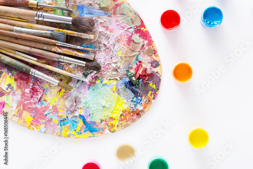 Art palette with colorful paint strokes, isolated