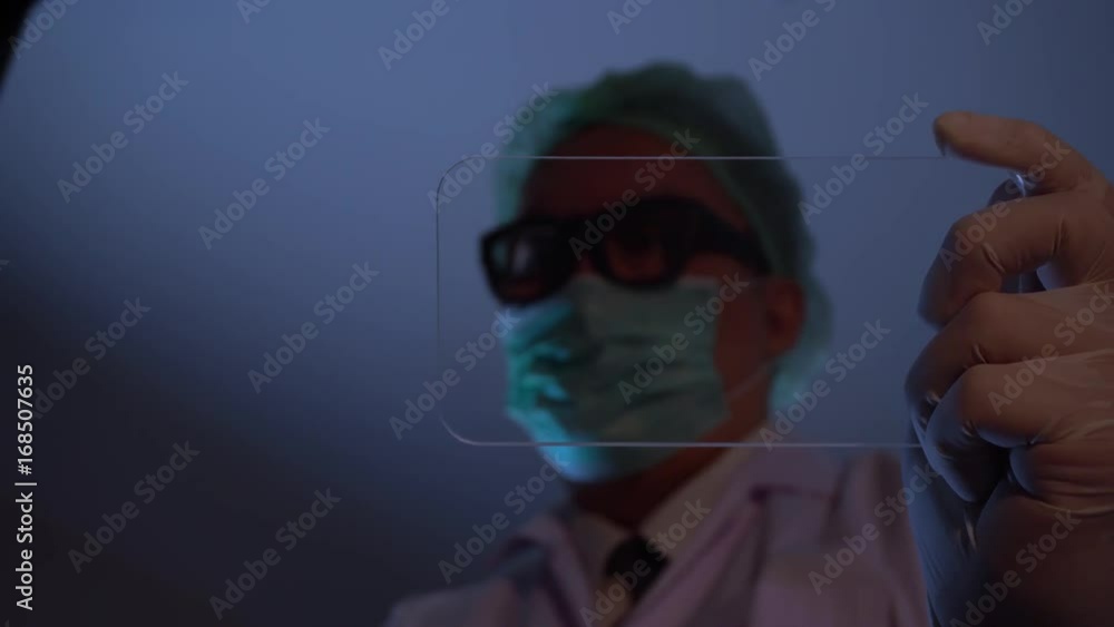 Male scientist working blank futuristic mobile or tablet for mock up in 4K (UHD) Male scientist working blank futuristic mobile or tablet for mock up in 4K (UHD)