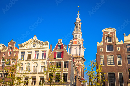 Traditional old buildings and and boats in Amsterdam, Netherlands. Canals of Amsterdam.