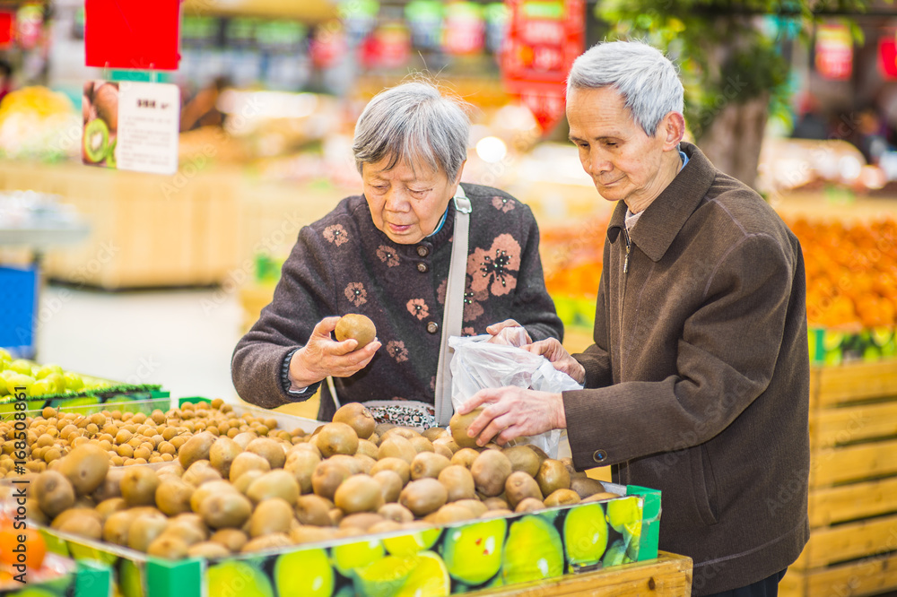 Senior Man and Woman Shopping Fruit.