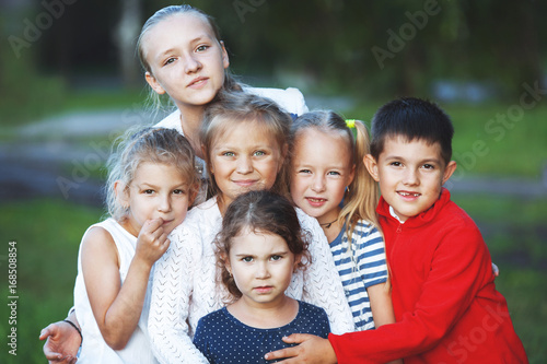 Close-up of the porter group of happy children in nature.