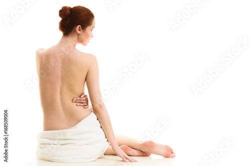 Sitting naked woman in white towel