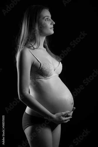 Black and white studio photography of a beautiful pregnant woman © Samo Trebizan