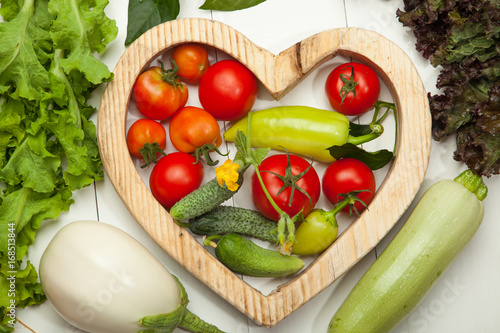 Fresh vegetables in the heart on a white background. Diet, a healthy lifestyle.