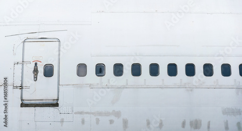 the side of airplane have the door and many window