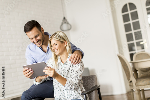 Young couple with tablet in...