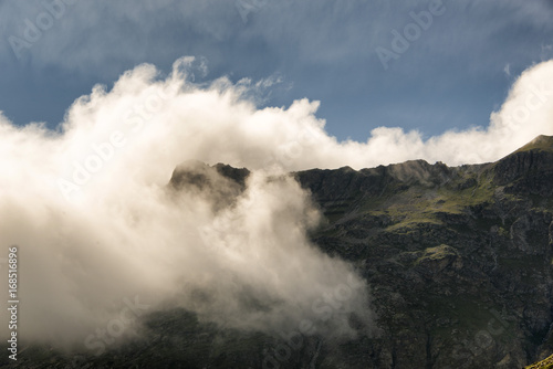 Clouds on the mountain in the alps © CoolimagesCo