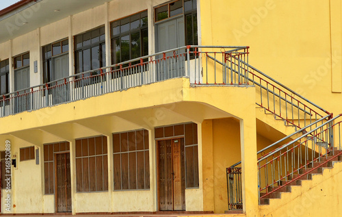 Construction industry in developing countries. Facade of a building with a balcony, windows and doors. Civil engineering. Close up.