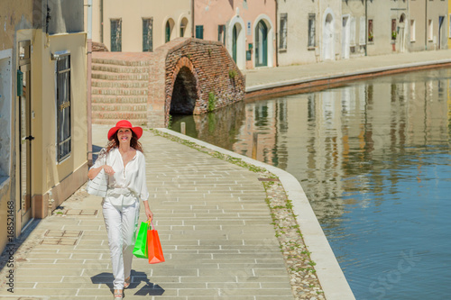 Beautiful tourist shopping in Italian village photo