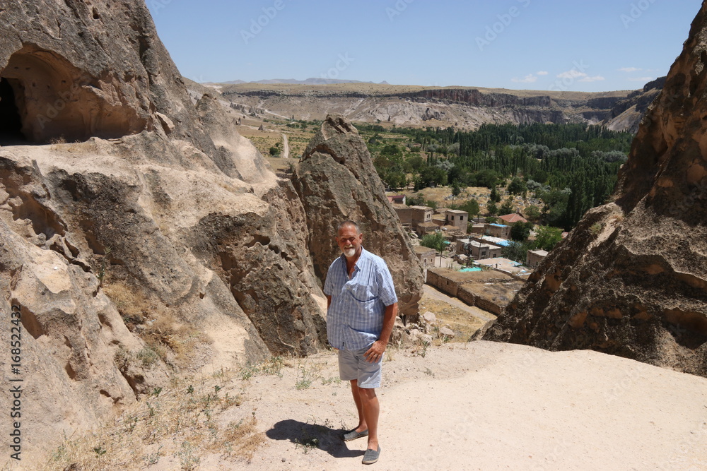 An English tourist visiting the Selime Monastery in Cappadocia, which is one of the largest religious buildings in Cappadocia. 2017