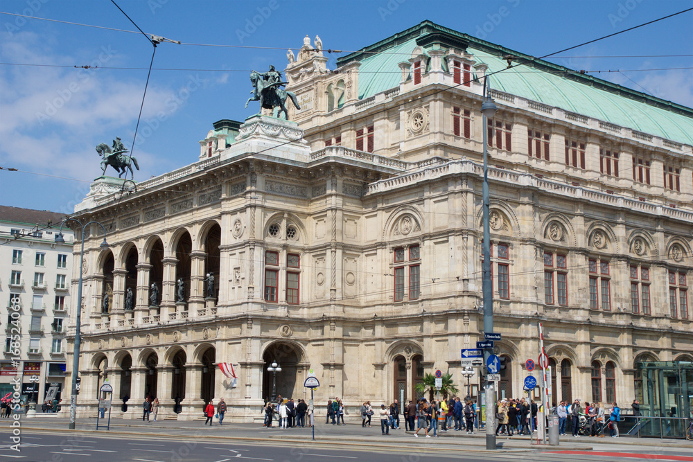 VIENNA, AUSTRIA - APR 29th, 2017:Moving traffic in front of the famous and historic State Opera House - Staatsoper in Wien