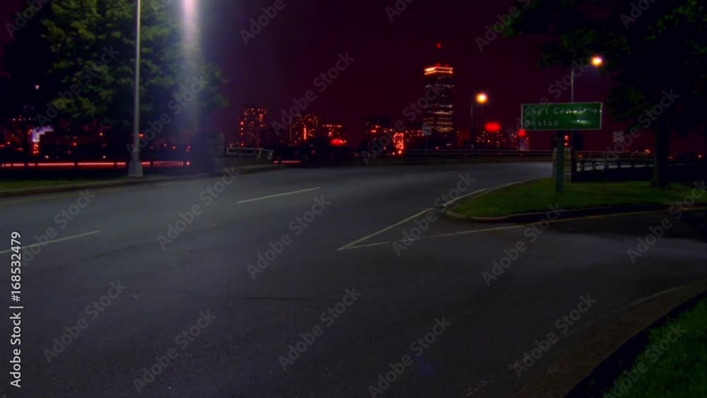 Time-lapse night shot cars curving around highway in Boston. Time-lapse night shot cars curving around highway in Boston.