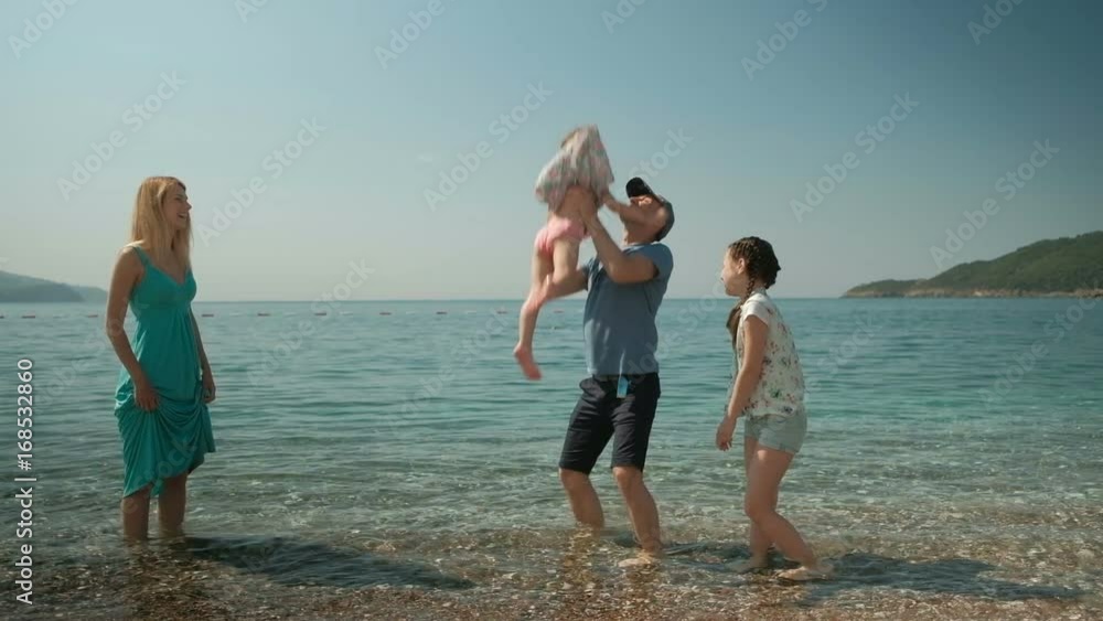 Family resting on lake, go out for evening walk together Family resting on lake, go out for evening walk together