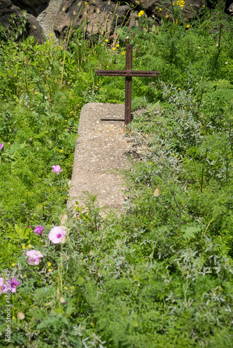 Grave with latin cross consisting of structural steel.