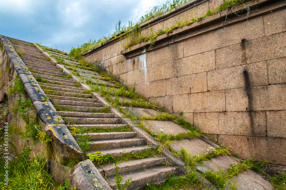 Ancient stone stairs. Stairs in an abandoned building.