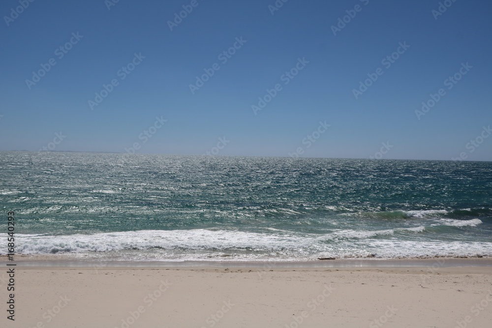 Sandy beach of Floreat Beach at Indian Ocean in summer, Western Australia Sandy beach of Floreat Beach at Indian Ocean in summer, Western Australia