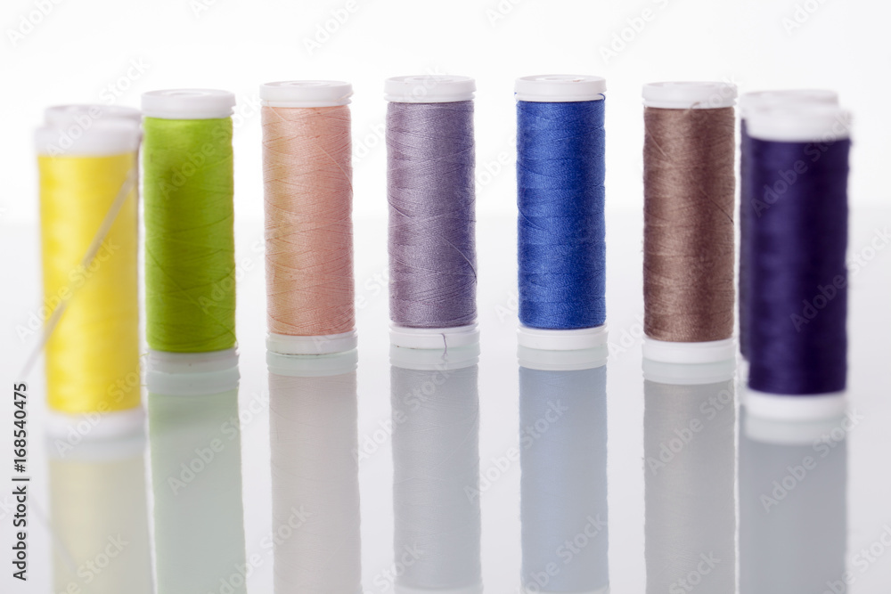 Sewing equipment and threads on white background. Sewing equipment and threads on white background.