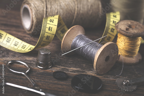 Fotografia, Obraz Sewing instruments, threads, needles in vintaae style