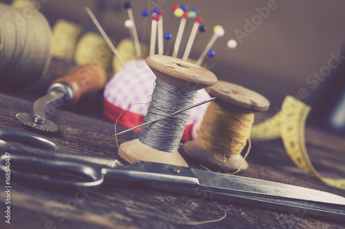 Fototapeta Sewing instruments, threads, needles, bobbins and materials.